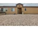 Single story home features a desert rock yard at 4314 Flaming Ridge Trl, Las Vegas, NV 89147