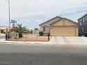 Charming single-story home featuring a spacious driveway and landscaped front yard at 4314 Flaming Ridge Trl, Las Vegas, NV 89147