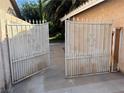 Wrought iron gate allowing access to the backyard at 4928 E Philadelphia Ave, Las Vegas, NV 89104