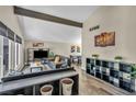 Spacious living room with a modern television and lots of light at 6815 Garden Grove Ave, Las Vegas, NV 89103