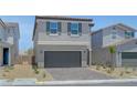 Charming two-story home with a gray exterior, well-manicured landscaping, and a two-car garage at 7086 Parkallen Ave, Las Vegas, NV 89113