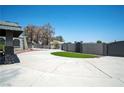 Circular driveway leads to a unique home, complemented by manicured landscaping at 7215 Ullom Dr, Las Vegas, NV 89118