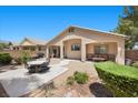 Inviting backyard with covered patio, desert landscaping, and outdoor seating, perfect for entertaining at 8021 Glacier Falls St, North Las Vegas, NV 89085