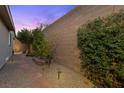 Serene backyard with gravel, stone pavers, and landscaped planting area at 816 Stannard Ct, Henderson, NV 89052