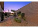 Landscaped backyard with stone pavers, gravel, and a seating area at 816 Stannard Ct, Henderson, NV 89052