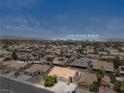 A beautiful aerial shot of the neighborhood with view of the Las Vegas Strip in the distance at 920 Serpentina Ave, Las Vegas, NV 89123