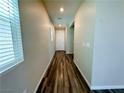 Inviting hallway features hardwood floors and leads to the front door at 9348 Wildcat Peak St, Las Vegas, NV 89178