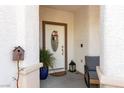 Close-up of front door with decorative wreath and potted plants, showcasing a charming entrance at , North Las Vegas, NV 89031