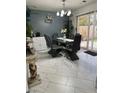 Dining area with modern table set and view to back yard at 10265 Moth Orchid Ct, Las Vegas, NV 89183