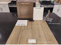 Close-up showcasing kitchen materials, including cabinets, countertops, faucet, and flooring samples at 1536 Little Penguin St, Las Vegas, NV 89138