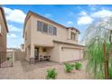 Beautiful stucco two-story home featuring a cozy front patio and a two-car garage at 1631 Desert Path Ave, North Las Vegas, NV 89032