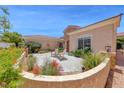 Private courtyard with seating area and mature landscaping offering a tranquil outdoor space at 2205 Sandstone Cliffs Dr, Henderson, NV 89044