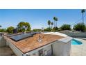 Roof with solar panels provides energy efficiency and a glimpse of the pool below at 2245 Sombrero Dr, Las Vegas, NV 89169