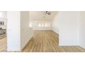 Bright, open living area with wood-look flooring, seamlessly connecting to other spaces at 2403 Sexton Ave, North Las Vegas, NV 89031