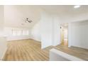 Bright open-concept living room with high ceilings and luxury vinyl flooring, perfect for entertaining at 2403 Sexton Ave, North Las Vegas, NV 89031