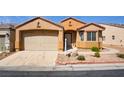 Inviting single-story home boasting a two-car garage and low-maintenance front yard at 3429 Glacial Lake St, Las Vegas, NV 89122