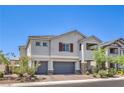 Charming two-story home with a two car garage and well-maintained landscaping in a desirable neighborhood at 3821 Nesting Wren Dr, North Las Vegas, NV 89084
