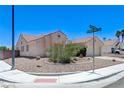 Charming single-story home with desert landscaping and a two-car garage at a corner lot at 4724 Victoria Beach Way, Las Vegas, NV 89130