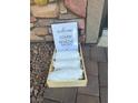 An entryway with a 'cover or remove shoes' sign and shoe covers at 5414 Enchanted Rose St, Las Vegas, NV 89148