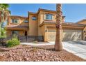 Beautiful two-story home with well-kept landscaping, a tile roof, and an attached two-car garage at 5805 Cabo San Lucas Ave, Las Vegas, NV 89131