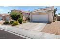 Charming single-story home featuring a two-car garage and low maintenance desert landscaping at 5914 Rose Sage St, North Las Vegas, NV 89031