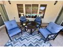 Comfortable outdoor seating area on the covered patio, perfect for relaxing and enjoying the outdoor space at 6614 Collingsworth St, Las Vegas, NV 89131