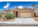 Charming single-story home featuring a xeriscaped front yard and an attached two-car garage at 10513 Shanna Trellis Ave, Las Vegas, NV 89144