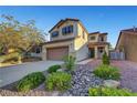 Charming two-story home with a well-manicured front yard and attached two-car garage, perfect for suburban living at 1069 Aspen Cliff Dr, Henderson, NV 89011