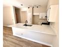 Well-lit kitchen featuring stone countertops and stainless steel appliances at 1333 Pacific Terrace Dr, Las Vegas, NV 89128