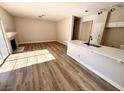 Sun-drenched living room featuring hardwood floors and fireplace at 1333 Pacific Terrace Dr, Las Vegas, NV 89128