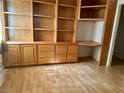 Bedroom with laminate flooring and a built in desk, cabinets, and drawers at 1409 Santa Margarita St # B, Las Vegas, NV 89146
