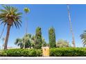 A property entrance framed by mature trees and lush greenery creates a private and inviting atmosphere at 1911 Valley Dr, Las Vegas, NV 89108
