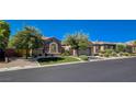 Beautiful single-story home with desert landscaping, stone accents, and a two-car garage at 2172 De Rouge Ave, Henderson, NV 89044