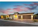 Beautiful single-Gathering home with a two-car garage, brick driveway, and landscaped front yard at 218 Vista Balla Ave, Las Vegas, NV 89138