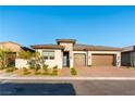 Attractive single-story home featuring a brick driveway and well-maintained landscaping at 218 Vista Balla Ave, Las Vegas, NV 89138