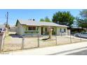 Modest single story home with xeriscaped yard and chain link fence at 2813 Willoughby Ave, Las Vegas, NV 89101