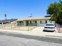 Modest single story home with xeriscaped yard and chain link fence at 2813 Willoughby Ave, Las Vegas, NV 89101