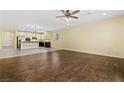 Open-concept living space with hardwood floors, recessed lighting, and a view of the kitchen at 3012 Chiefs Ct, North Las Vegas, NV 89032