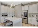 Modern kitchen featuring a large island with bar seating and stainless steel appliances at 3218 Squire St, Las Vegas, NV 89135