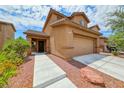 Inviting two-story home with a two car garage, and a well-maintained landscape at 4421 Galapagos Ave, North Las Vegas, NV 89084