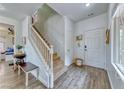 Bright foyer features hardwood floors, white trim, and staircase at 4421 Galapagos Ave, North Las Vegas, NV 89084