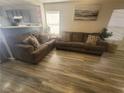 Cozy living area featuring wood-look floors and neutral paint, offering a warm ambiance at 5404 Walcott Dr, Las Vegas, NV 89118