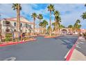 Exterior view of community entrance with palm trees and desert landscaping at 700 Carnegie St # 4113, Henderson, NV 89052