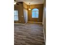 Bright living room featuring wood-look flooring and a window for natural light at 700 Carnegie St # 4113, Henderson, NV 89052