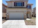 Charming two-story home featuring a two-car garage and desert landscaping in front at 8529 Gold Flash Ave, Las Vegas, NV 89129