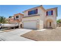 Inviting two-story home featuring a convenient two-car garage and neutral-toned exterior at 8529 Gold Flash Ave, Las Vegas, NV 89129