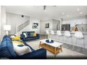 Open concept living room and kitchen with modern decor and plenty of natural light at 8683 Luxuriant Ave # Lot 26, Las Vegas, NV 89148