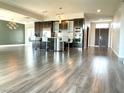 Bright open concept kitchen with sleek countertops, breakfast bar and seating at 8925 W Flamingo Rd # 319, Las Vegas, NV 89147
