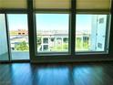 Living room featuring large windows with views of the city and surrounding neighborhood at 8925 W Flamingo Rd # 319, Las Vegas, NV 89147