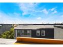 A rooftop view of a home showcasing the tile roof and the surrounding neighborhood at 9050 W Tropicana Ave # 1017, Las Vegas, NV 89147